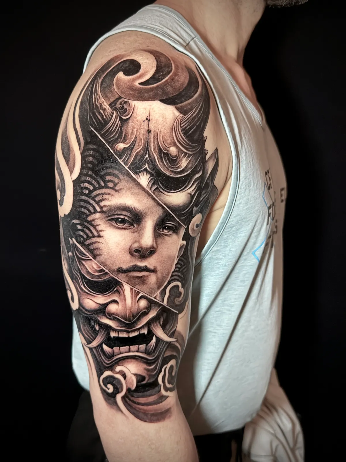 Black and grey realism portrait with Japanese hannya mask and baroque filigree half sleeve tattoo by Andras Tattoo